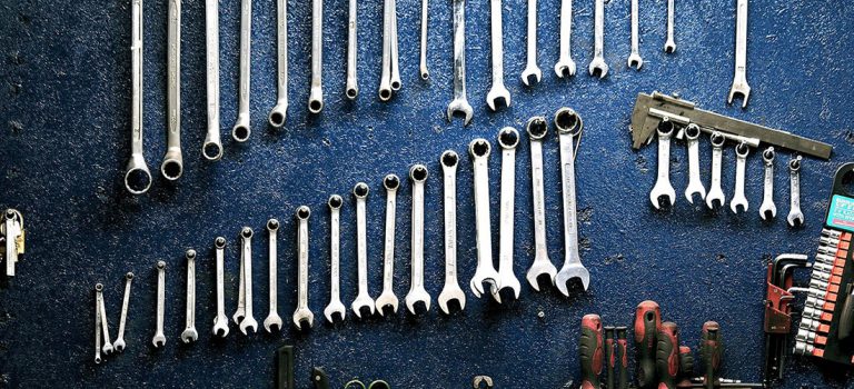 Various tools hanging on a wall.