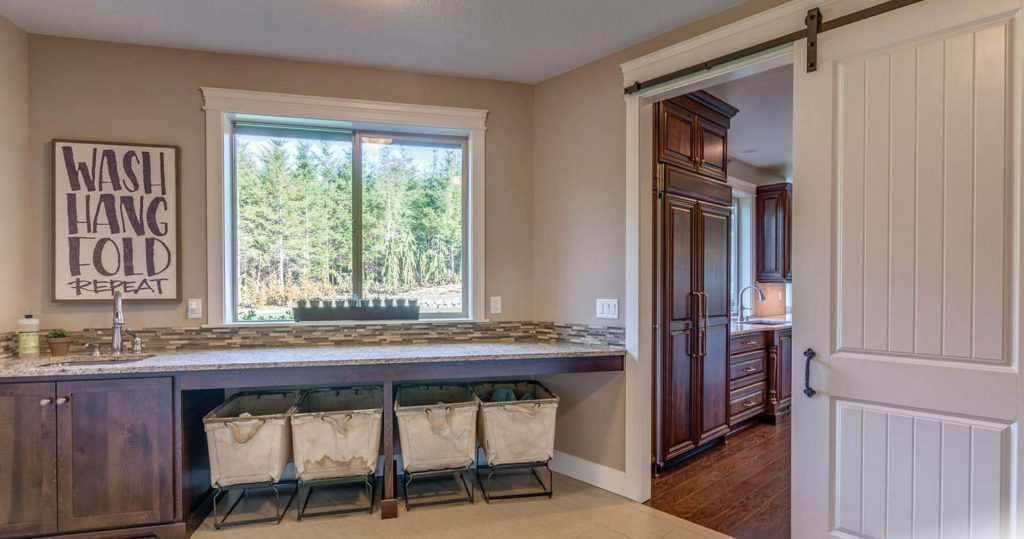 laundry room with barn style door